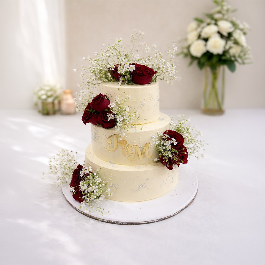 Classic Three-Tier Wedding Cake with Red Roses