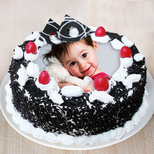 round-shape-black-forest-cake-with-a-baby-photo-on-top