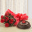 round-shape-chocolate-cake-with-red-roses-bouquet