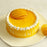 yellow-colour-dainty-round-shape-mago-cake