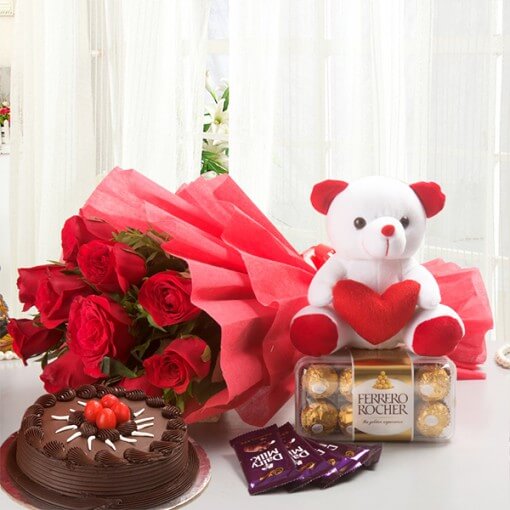 round-chocolate-cake-with-flowers-bouquet-and-teddy-ferrero-rocher