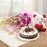 round-shape-cake-with-small-teddy-with-lillies