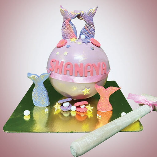 Ball-shape-pinata-cake-with-hammer-with-fish-decoration