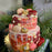two-tier-rasmalai-cake-decored-with-muffins-on-top